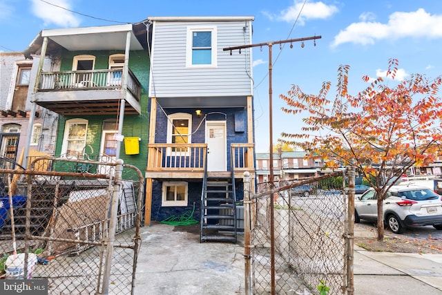 view of front of house with a balcony