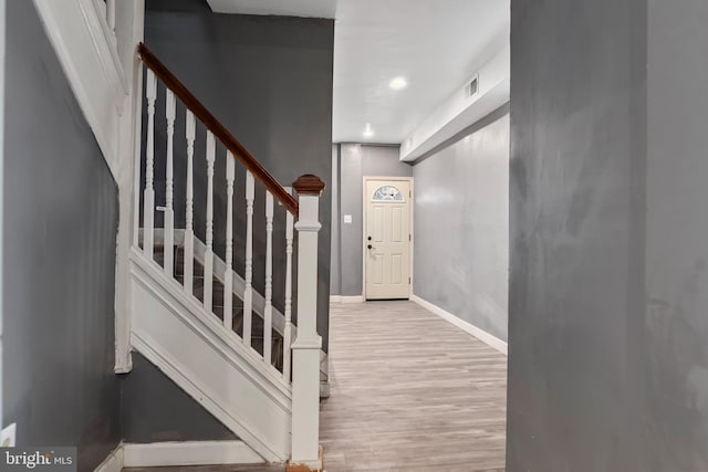 foyer entrance with light hardwood / wood-style flooring