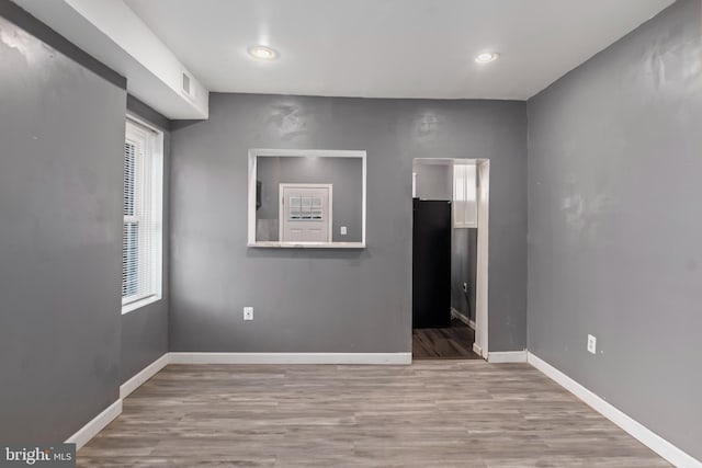 unfurnished room featuring light hardwood / wood-style flooring