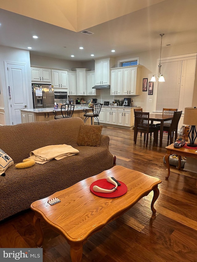 living room with dark wood-type flooring