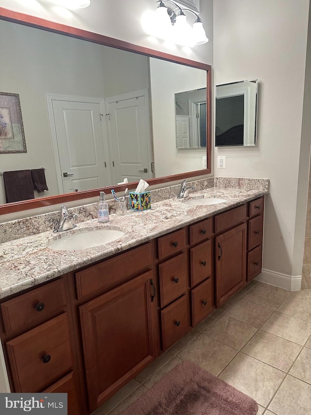 bathroom featuring tile patterned floors and vanity