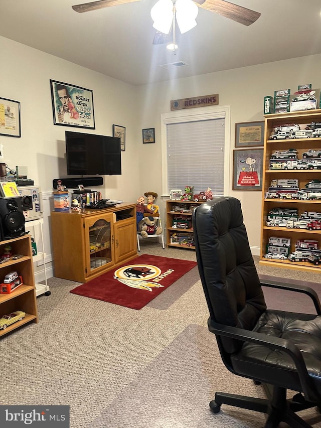 home office with carpet and ceiling fan