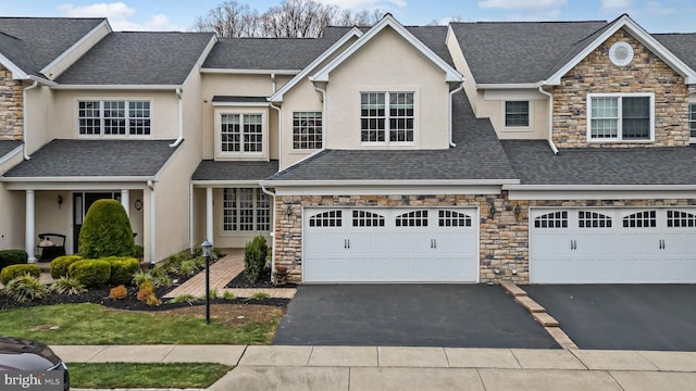 townhome / multi-family property featuring a garage