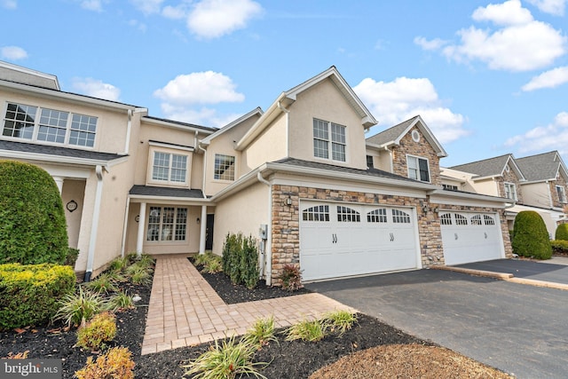 townhome / multi-family property featuring a garage