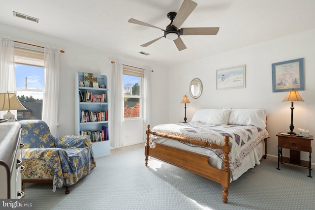 bedroom featuring ceiling fan and light colored carpet
