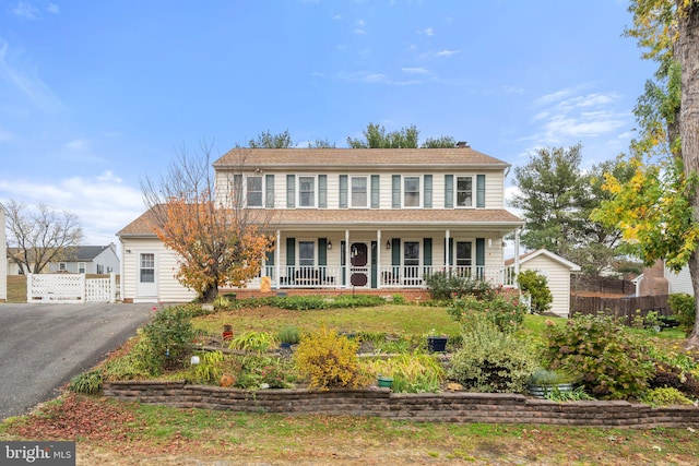 colonial inspired home with covered porch