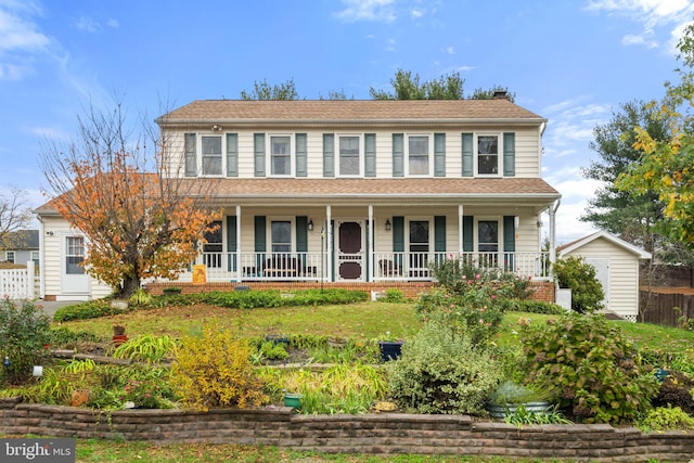 colonial-style house featuring covered porch