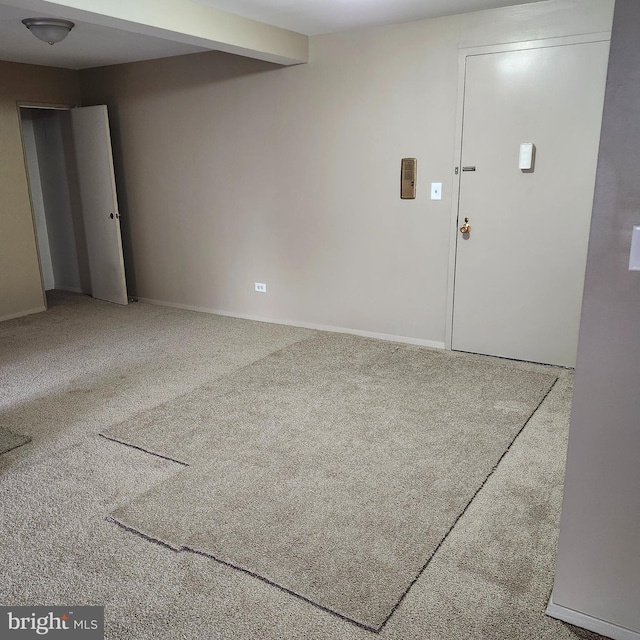 unfurnished room featuring carpet flooring