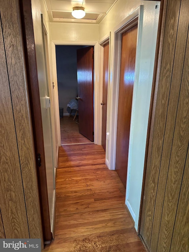 hallway featuring dark wood-type flooring