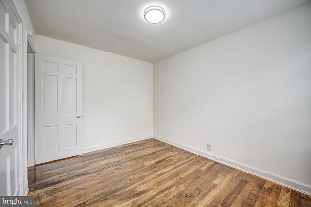 empty room featuring hardwood / wood-style floors