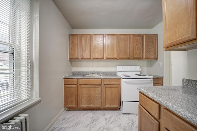 kitchen featuring electric stove, sink, and radiator