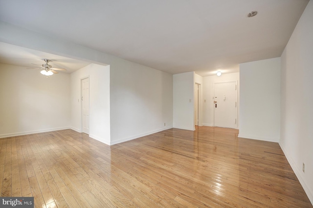 spare room featuring ceiling fan and light hardwood / wood-style floors