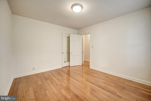 unfurnished room featuring light hardwood / wood-style flooring