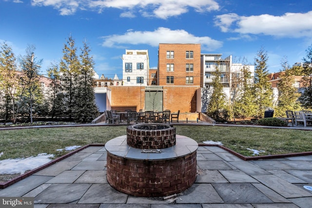 view of patio / terrace featuring an outdoor fire pit