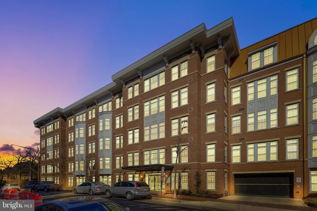 view of outdoor building at dusk