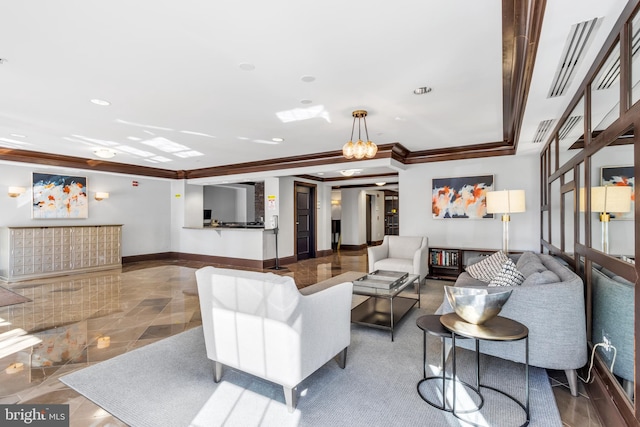 living room featuring ornamental molding and a chandelier