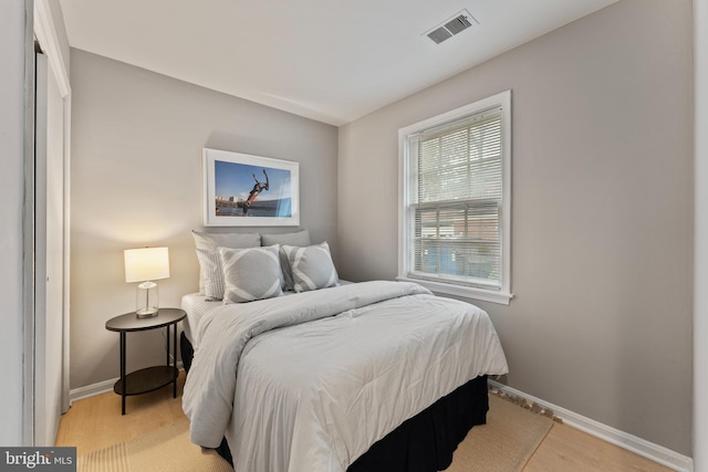 bedroom featuring light wood-type flooring