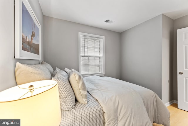 bedroom with light hardwood / wood-style floors