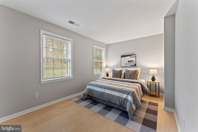 bedroom with light hardwood / wood-style flooring