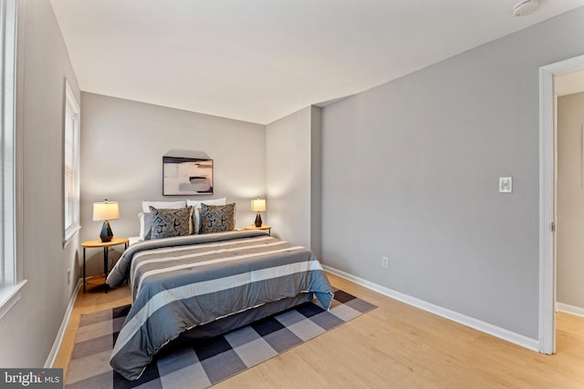 bedroom with light wood-type flooring