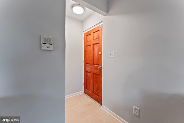 doorway to outside with light wood-type flooring