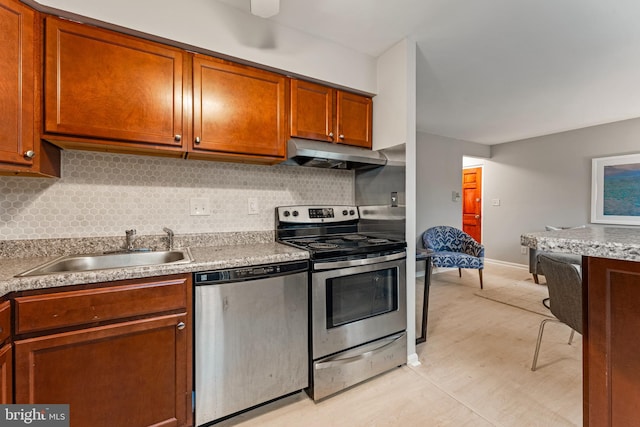 kitchen with backsplash, sink, and appliances with stainless steel finishes