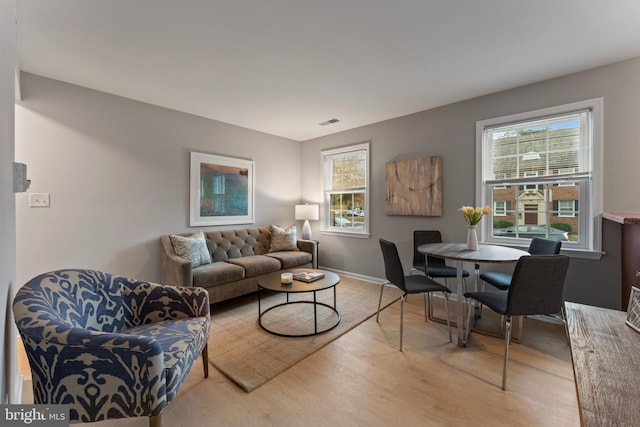 living room with light hardwood / wood-style flooring