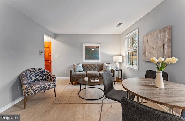 living room with light hardwood / wood-style floors