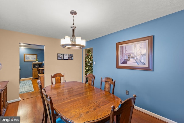 dining space featuring light wood-type flooring