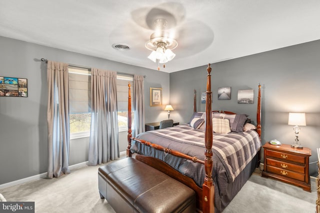 bedroom with light carpet and ceiling fan