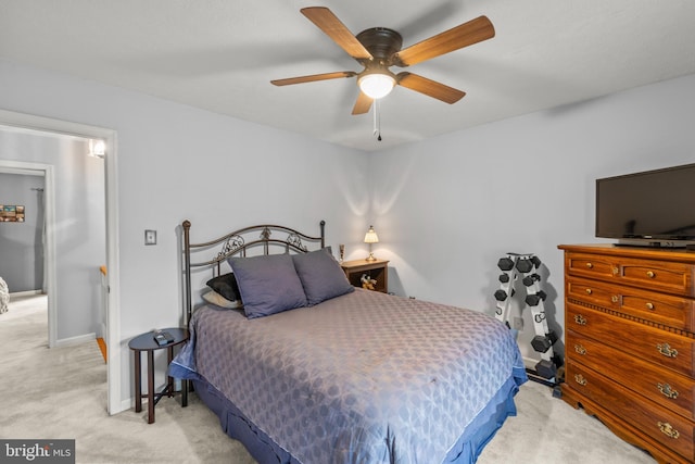 bedroom with light colored carpet and ceiling fan