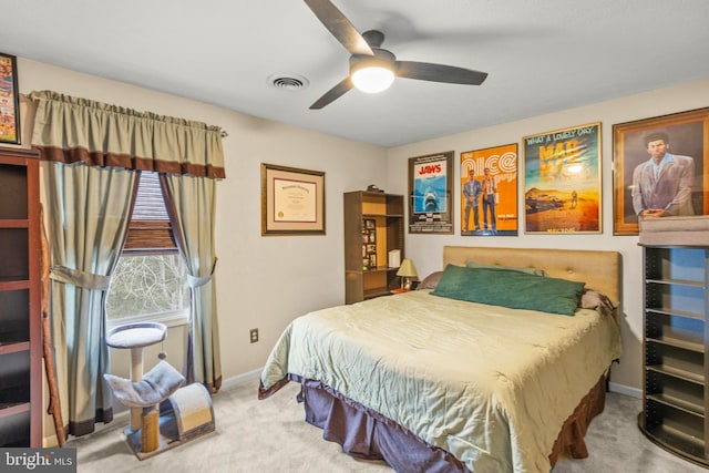 bedroom with ceiling fan and carpet floors