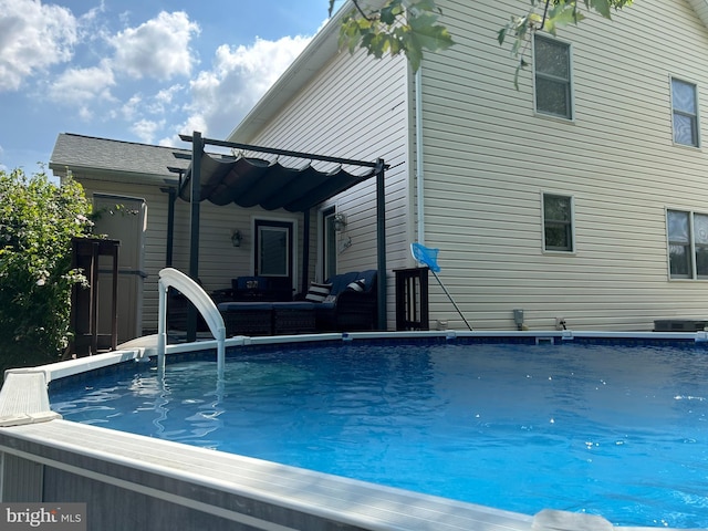 view of swimming pool with an outdoor living space