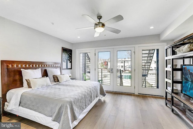 bedroom with access to exterior, ceiling fan, hardwood / wood-style floors, and french doors