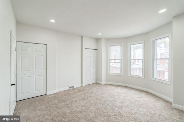 spare room with light carpet