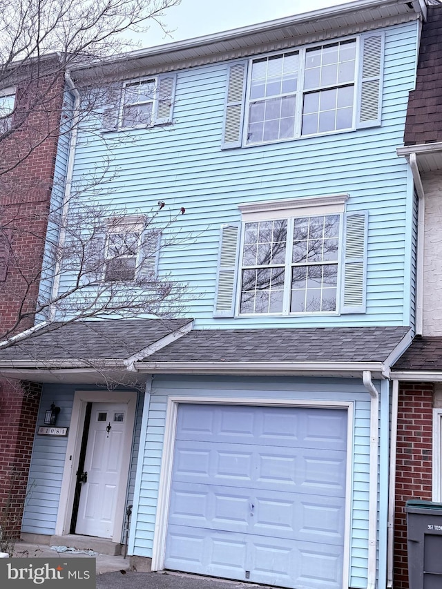 townhome / multi-family property featuring a garage