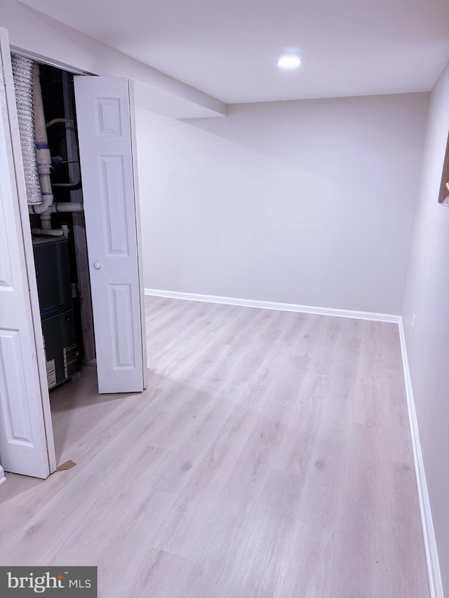 basement featuring light wood-type flooring