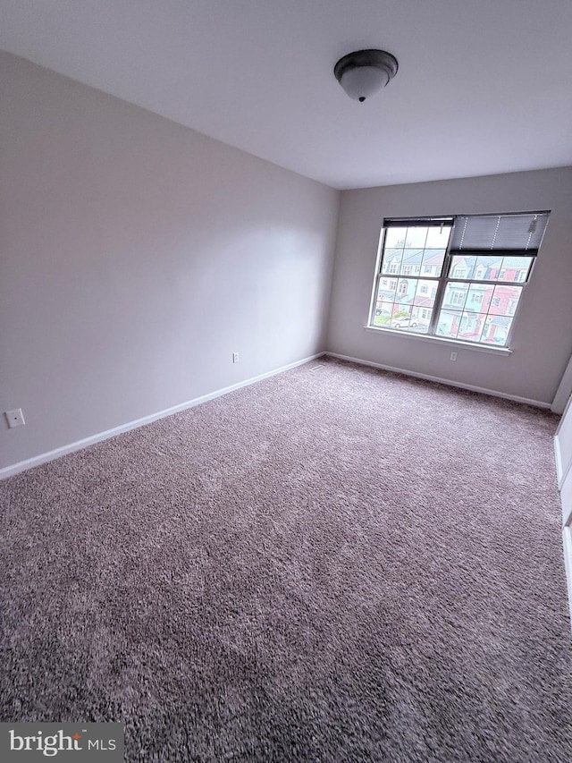 unfurnished room featuring carpet flooring