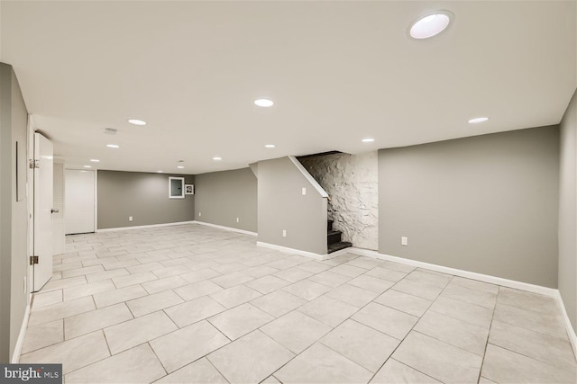 basement featuring light tile patterned flooring