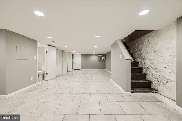 basement with light tile patterned floors