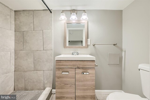 3927 Boarman Ave, Baltimore, MD 21215 - full bathroom featuring toilet, a tile shower, and vanity