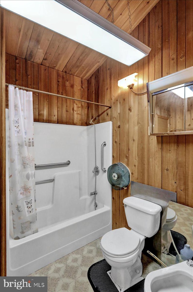 bathroom featuring wooden ceiling, a bidet, toilet, wooden walls, and shower / bath combo with shower curtain