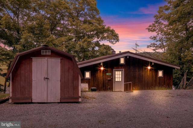 view of outdoor structure at dusk