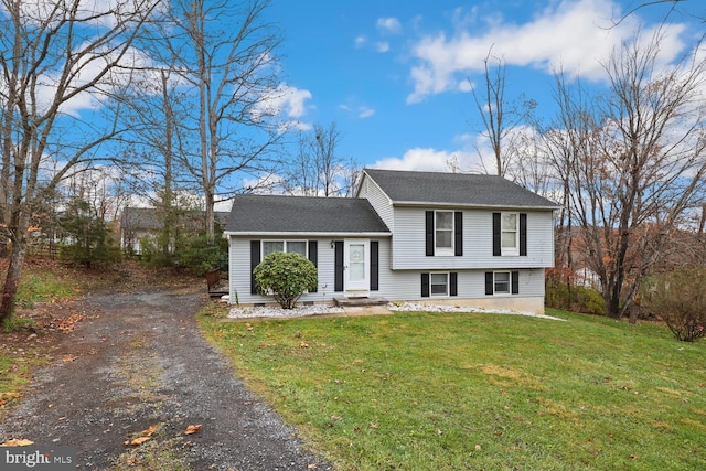 split level home featuring a front yard