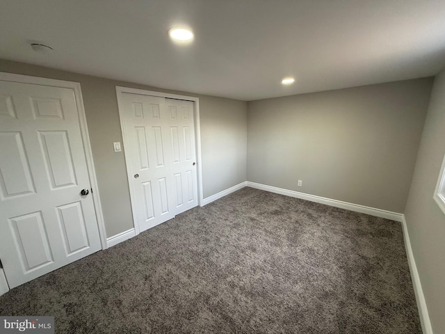 unfurnished bedroom with carpet flooring