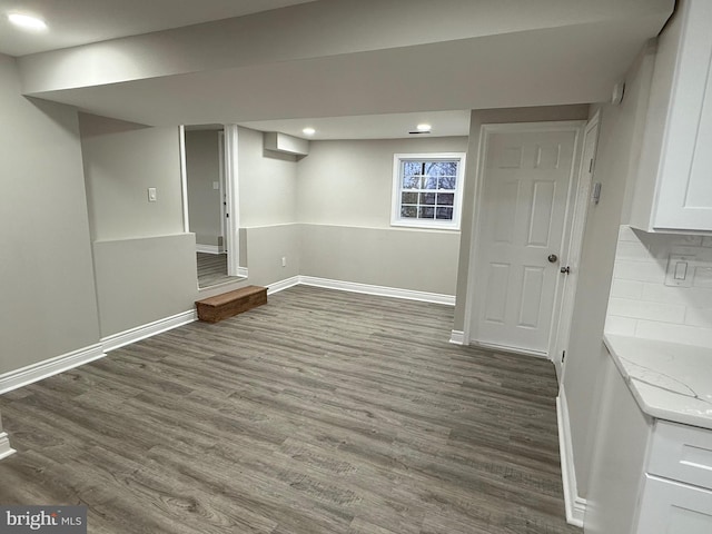 basement featuring dark wood-type flooring