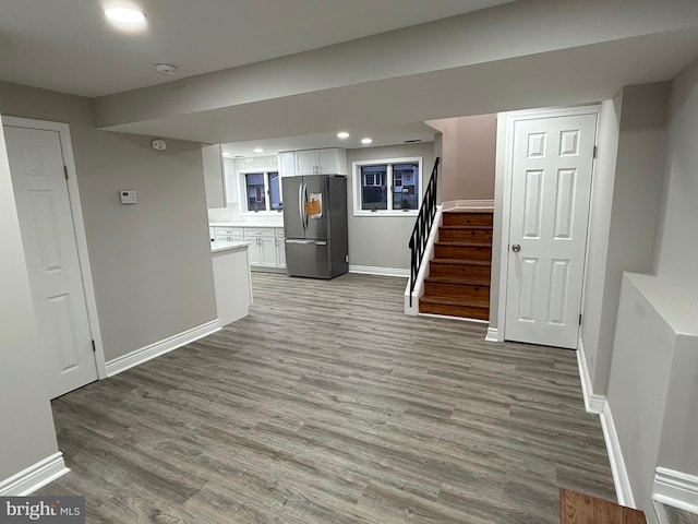 unfurnished living room featuring hardwood / wood-style flooring