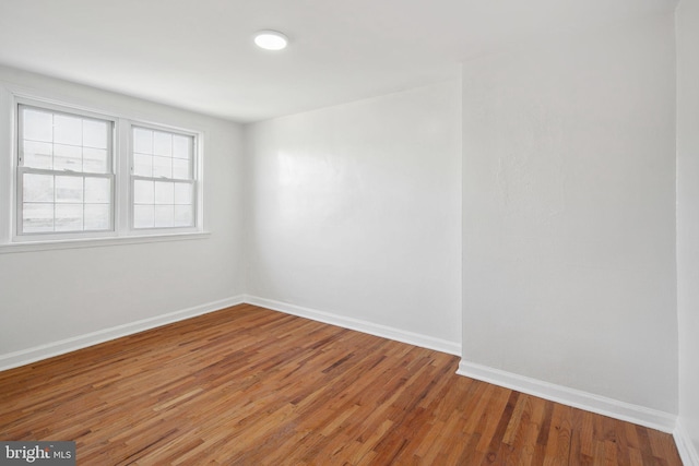 empty room featuring hardwood / wood-style flooring