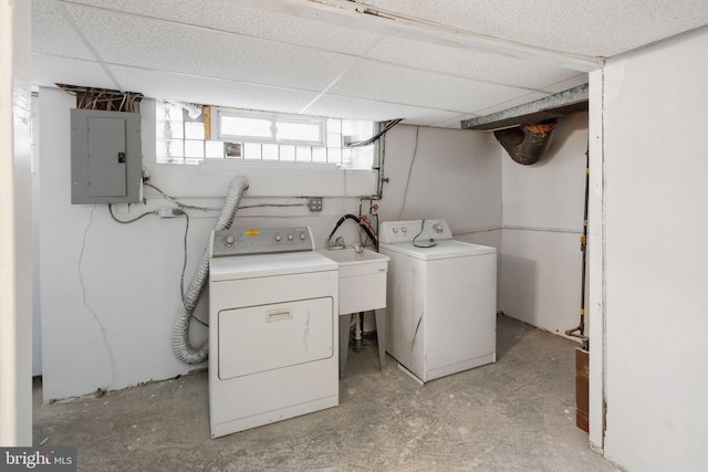 laundry area featuring electric panel and washer and clothes dryer