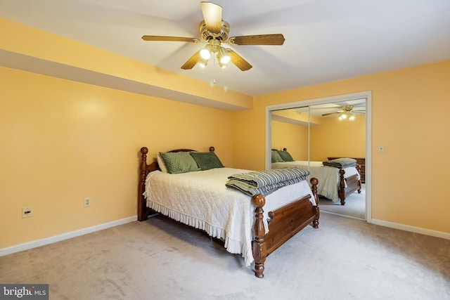 bedroom with carpet, a closet, and ceiling fan